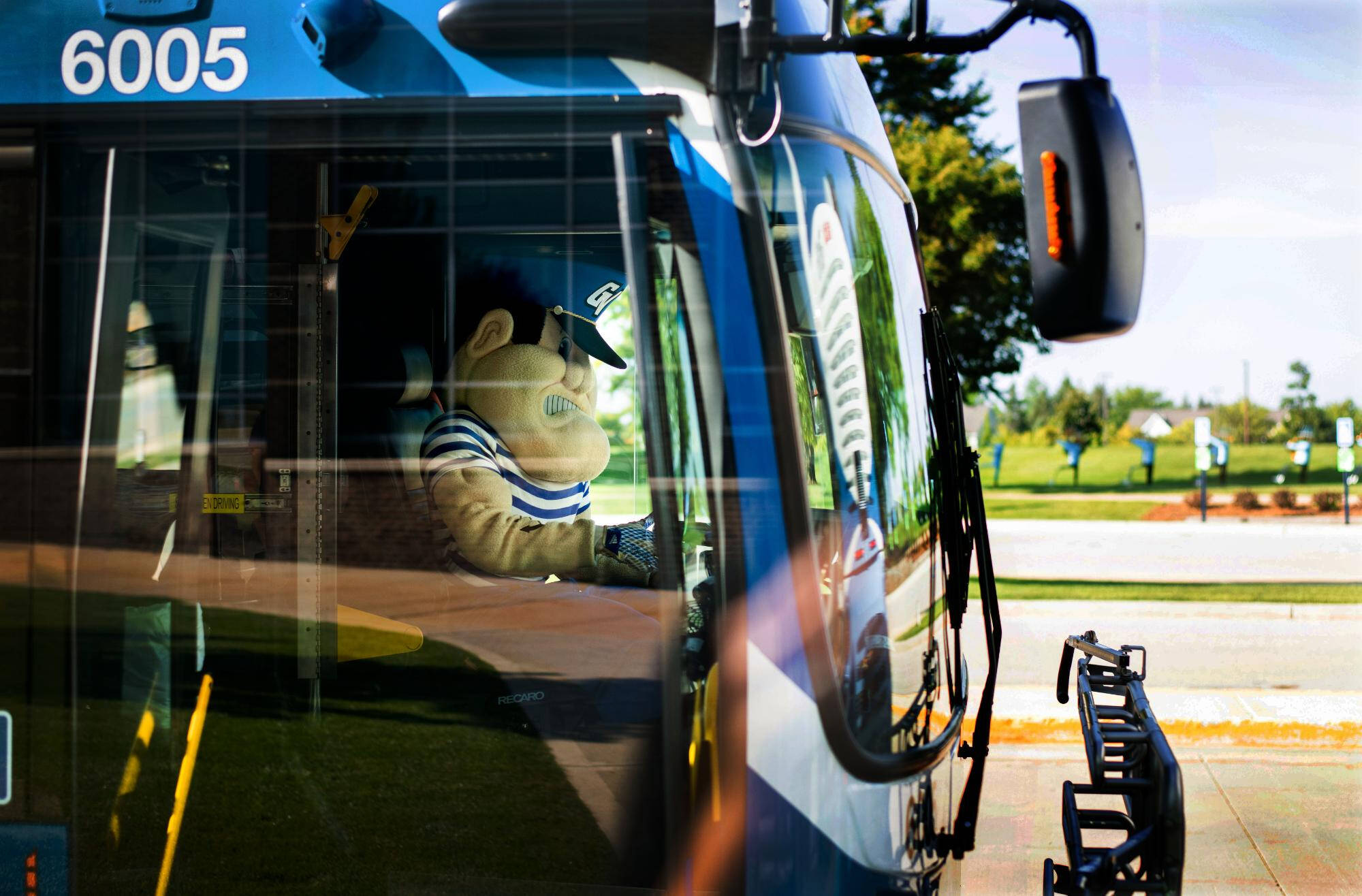 Louie the Laker driving the Laker Line bus